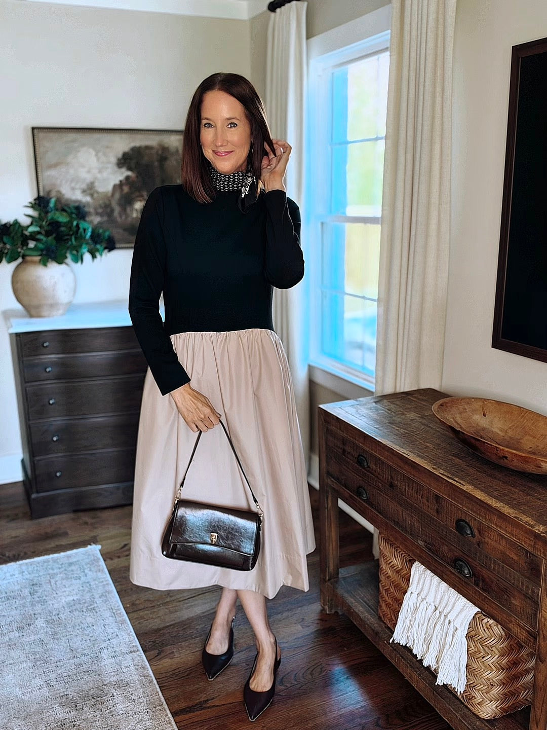 Brooke in a black and blush midi dress