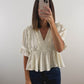The Ruffle Peplum Top in Cream