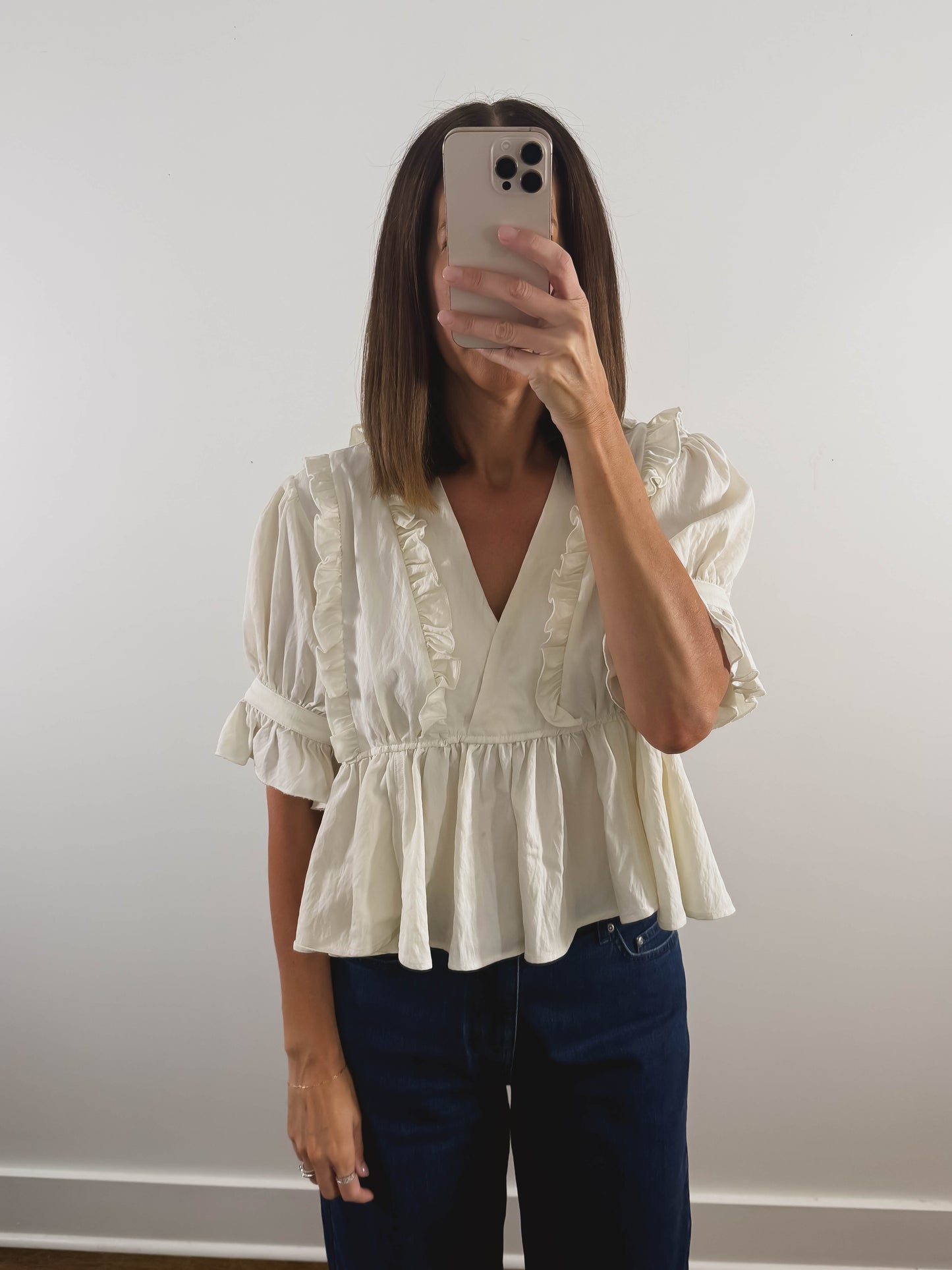 The Ruffle Peplum Top in Cream