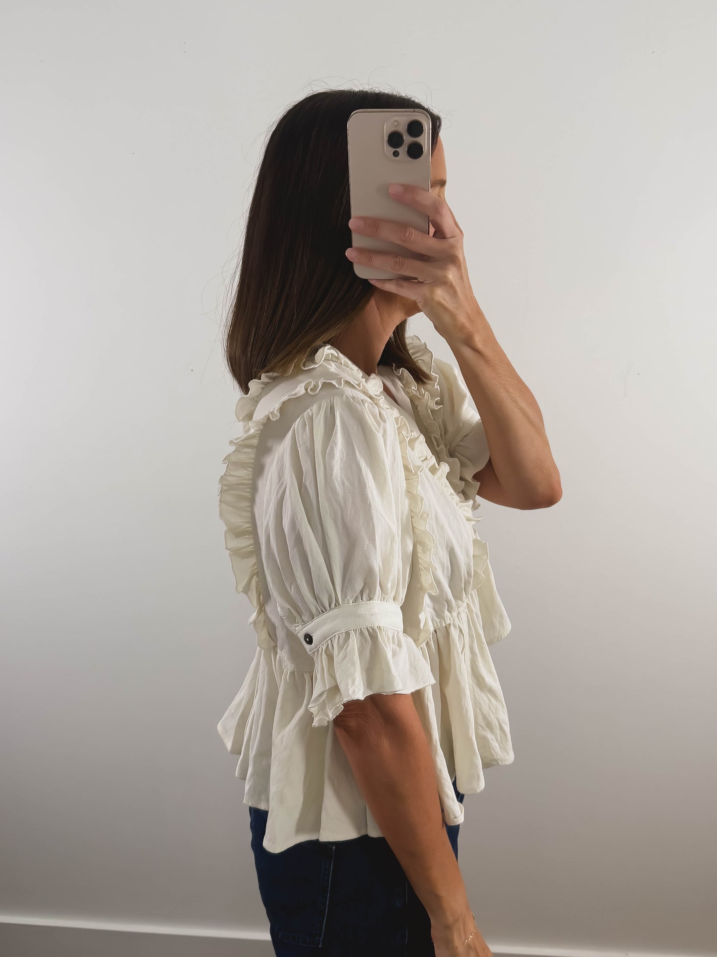 The Ruffle Peplum Top in Cream