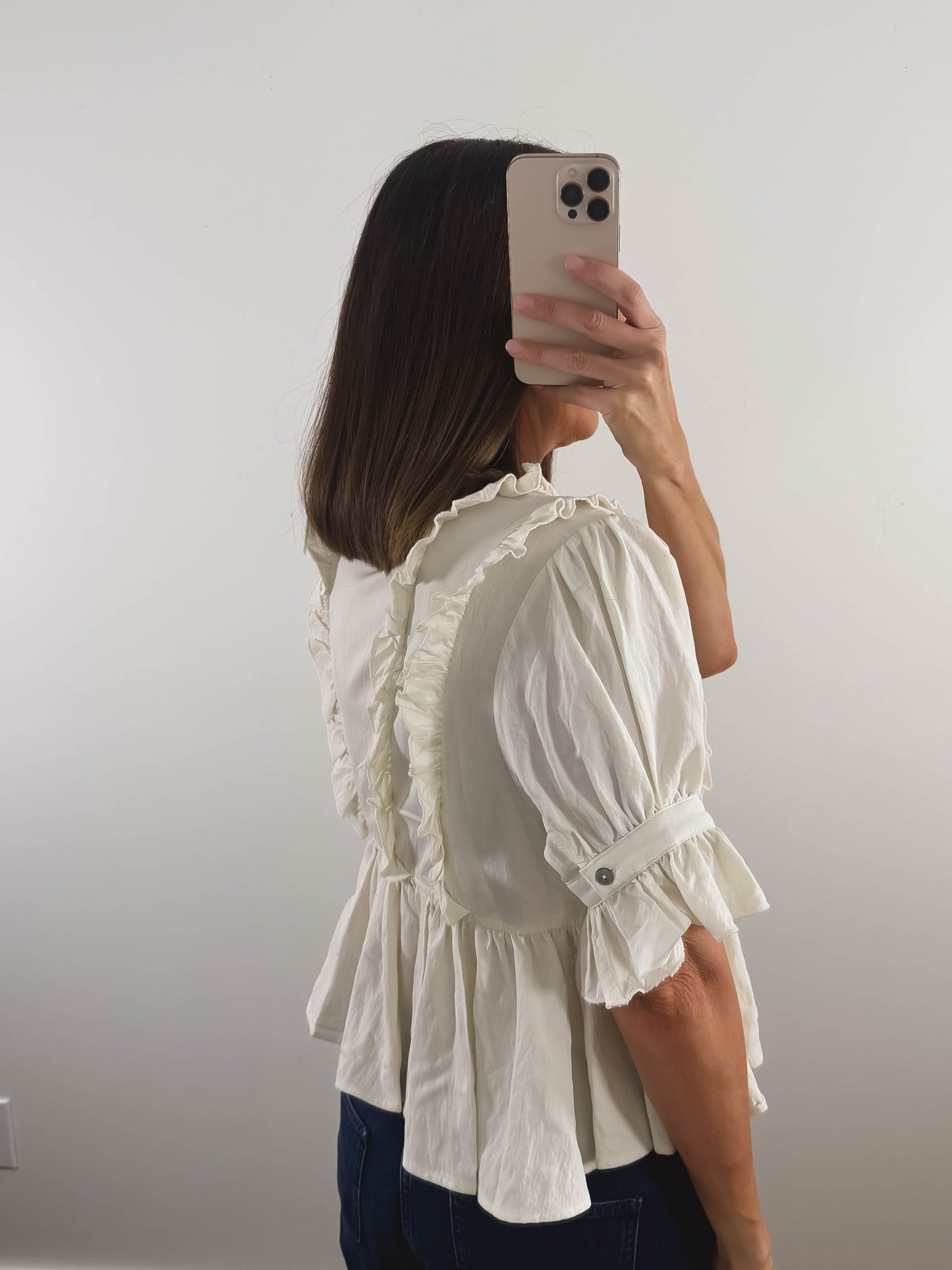 The Ruffle Peplum Top in Cream